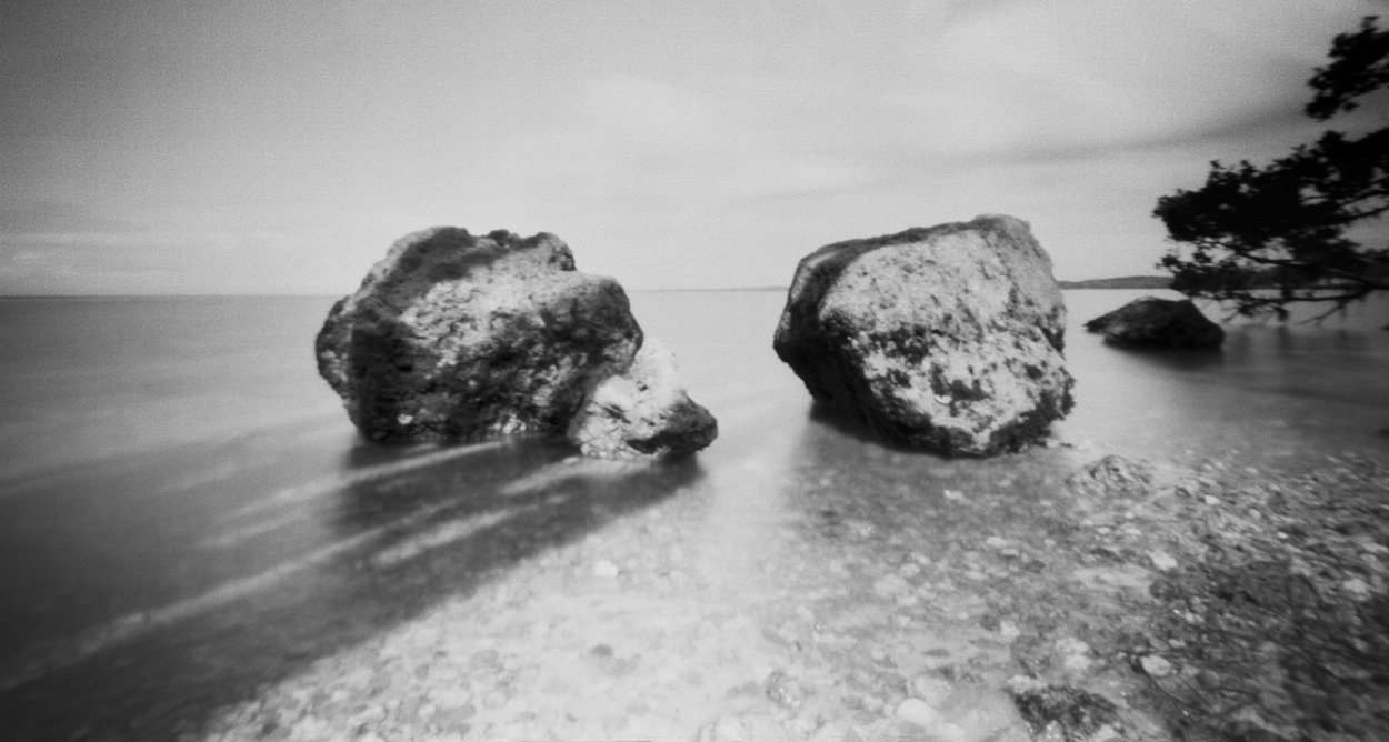 This image was captured on film with a 6 x 9 wide angle pinhole camera. A pinhole camera has no lens, no viewfinder, and no electronics. Limestone rocks in Biscayne National Park in Florida. Biscayne National Park is for the most part under water and therefore the largest underwater park in the US. The park stretches' from South Miami to Key Largo These rocks are just a little larger than a Basketball.
