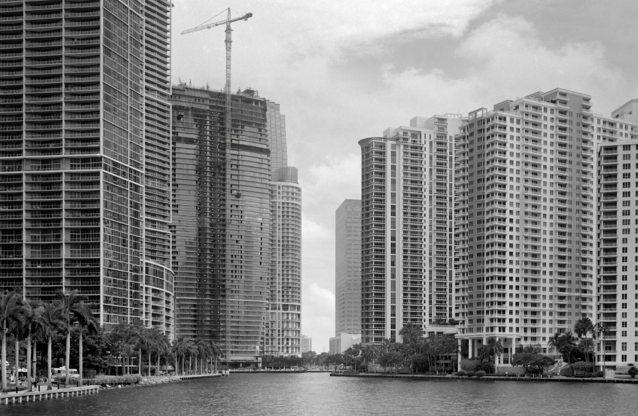View of midtown Miami Skyline with offices and Apartments with the Miami River in the foreground. This image was captured on Black and white film with a 1938 Zeiss Ikon 6 x 9 cm Camera.