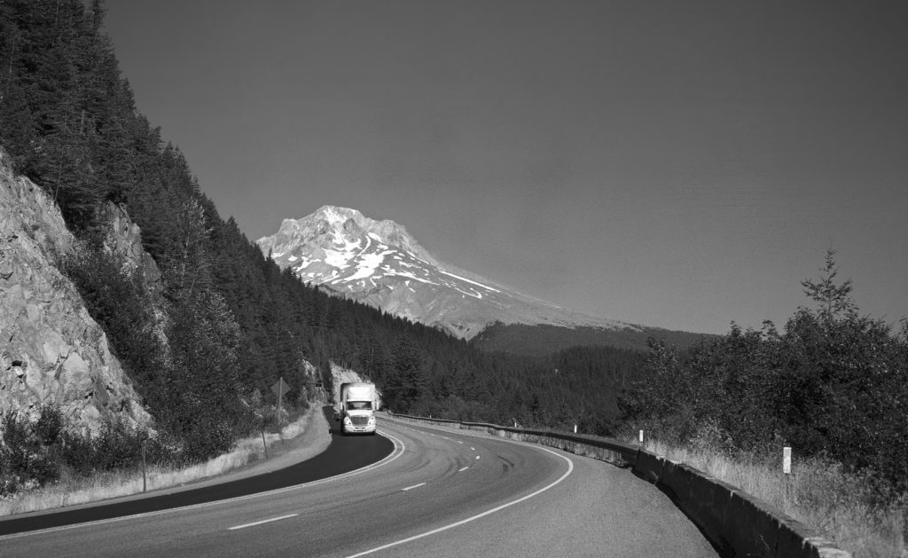 Route 26 goes from West to East and at some point, it passes Mt. Hood, Oregon, which is a "potentially active" volcano. Meaning; something might be brewing underneath all that rock. Mnt Hood is about 11300 feet. (3500 meters) . Mount Hood is located in the Oregon Cascades and is part of the Pacific Ring of Fire, Captured with a large format camera on B/W film, which was home developed